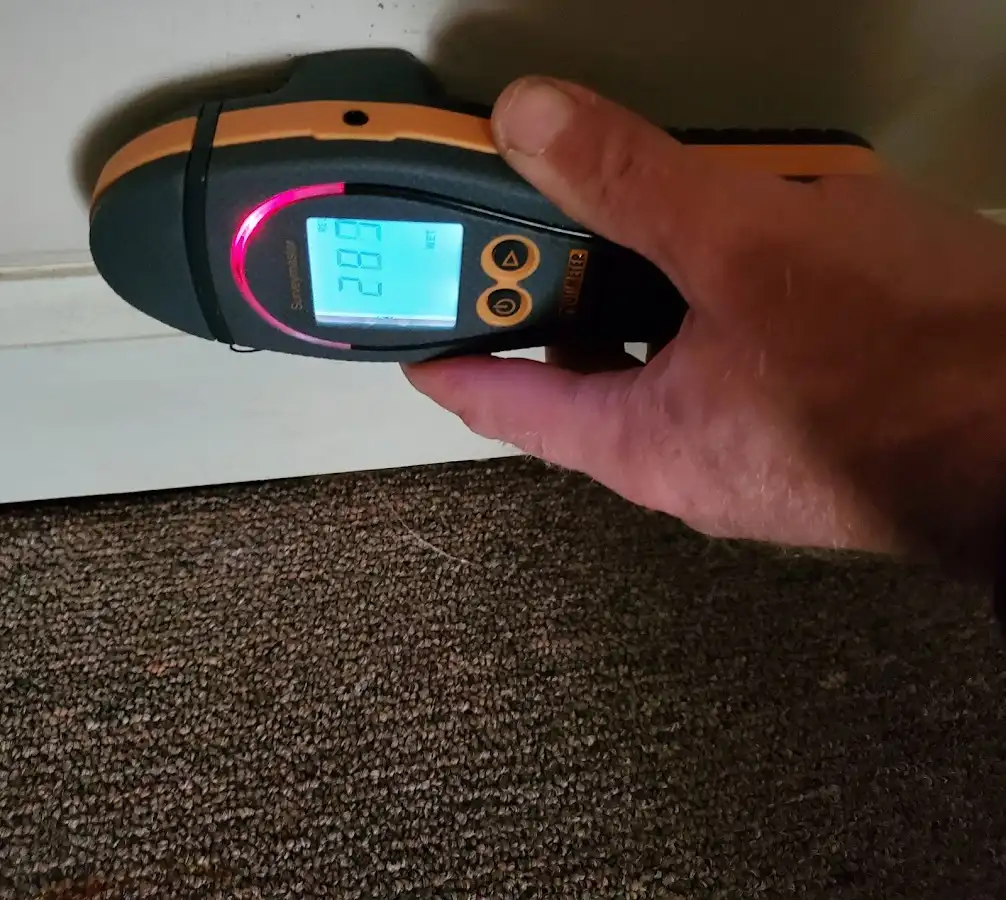 Moisture detection at baseboard during Storm Damage Restoration in Litchfield Park